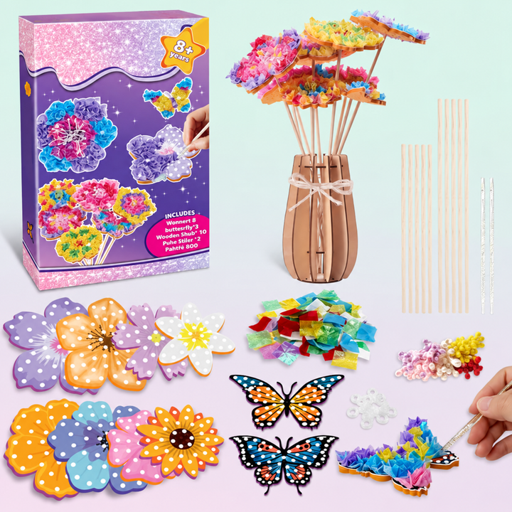 Flower craft kit with fabric pieces, foam flowers, butterflies, tools, and a vase holding finished blooms