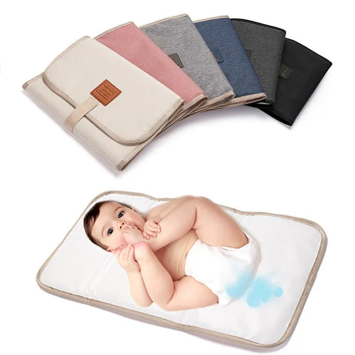 Six folded changing mat colors above a baby lying on an open mat