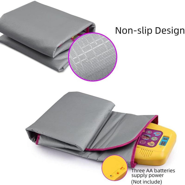 Folded dance mat showing its gray textured underside and compartment for three AA batteries