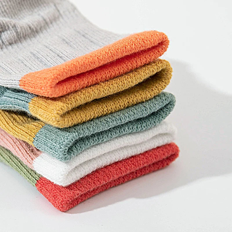 Stacked ribbed socks showing contrasting cuffs and textured knit fabric