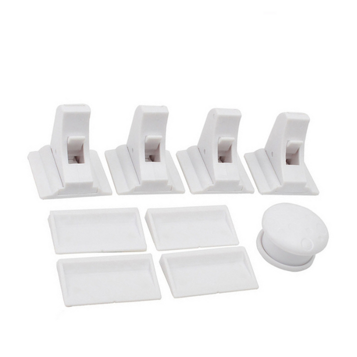 Four white cabinet locks with matching mounting plates and one magnetic key