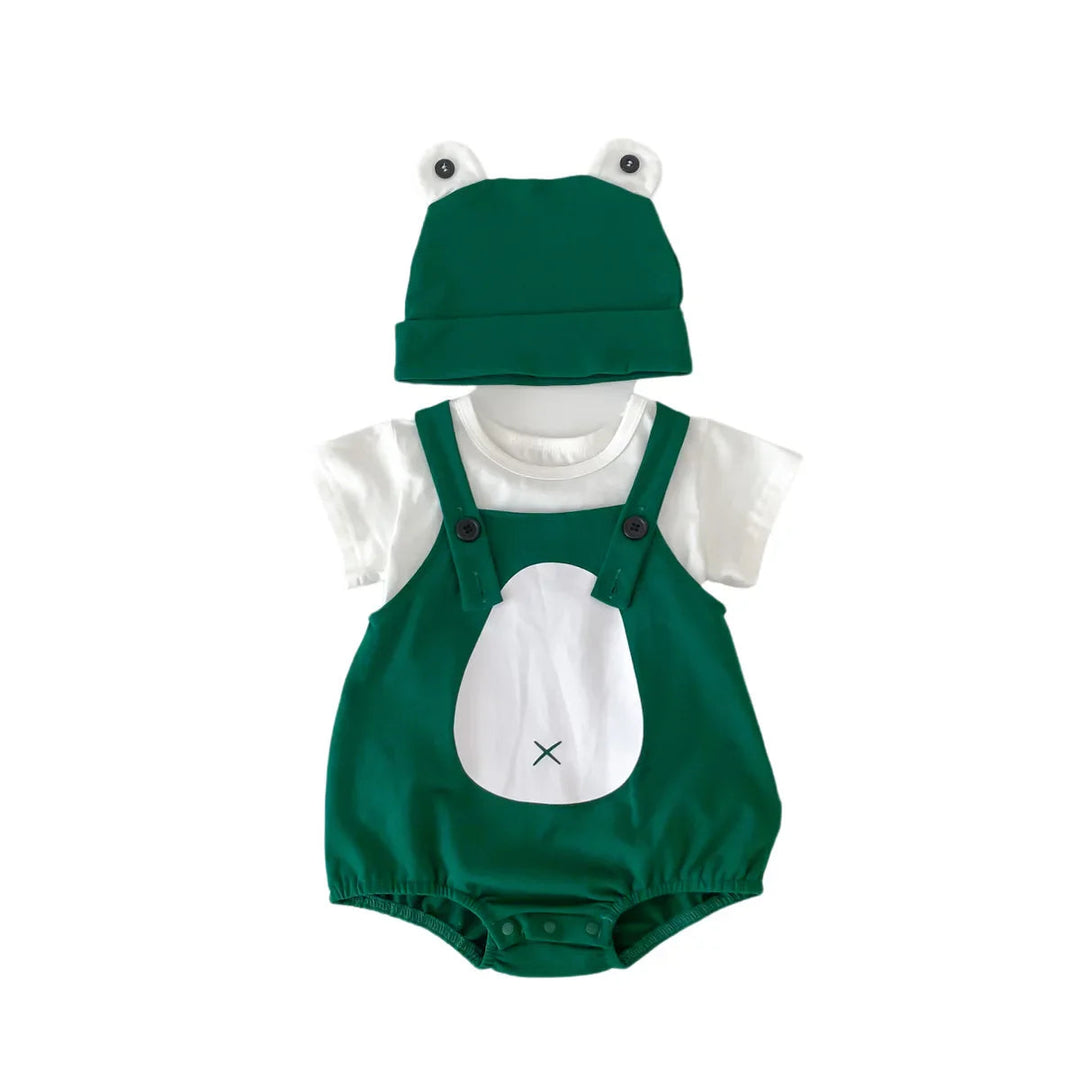 Front view of the green frog romper styled with a white top and matching frog-eye cap