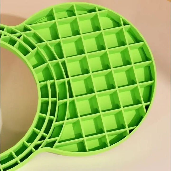 Grid reinforcement on the underside of a green frog pogo stick foot platform.