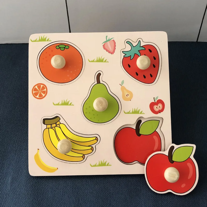 Fruit wooden peg puzzle with orange, strawberry, pear, banana, and apple pieces