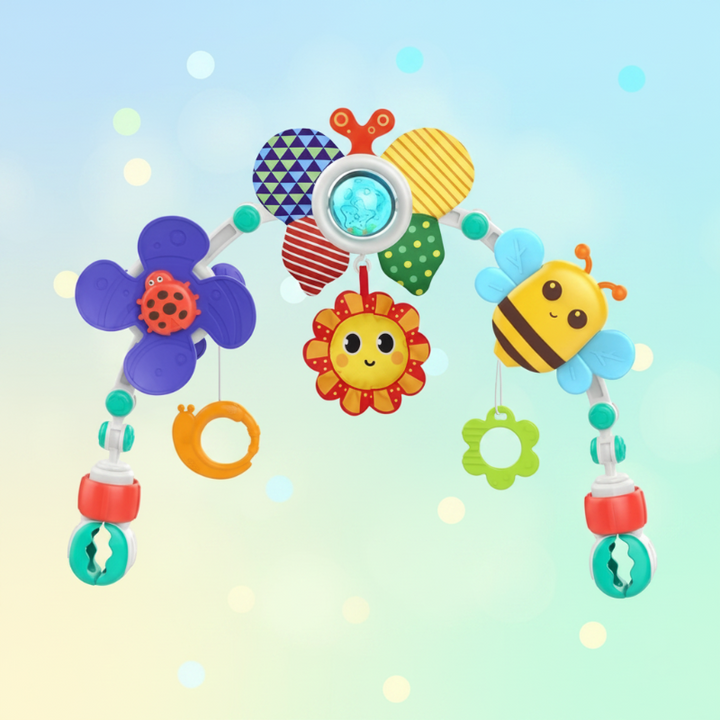 Colorful baby play arch with a patterned flower, smiling sun, bee, and hanging rings