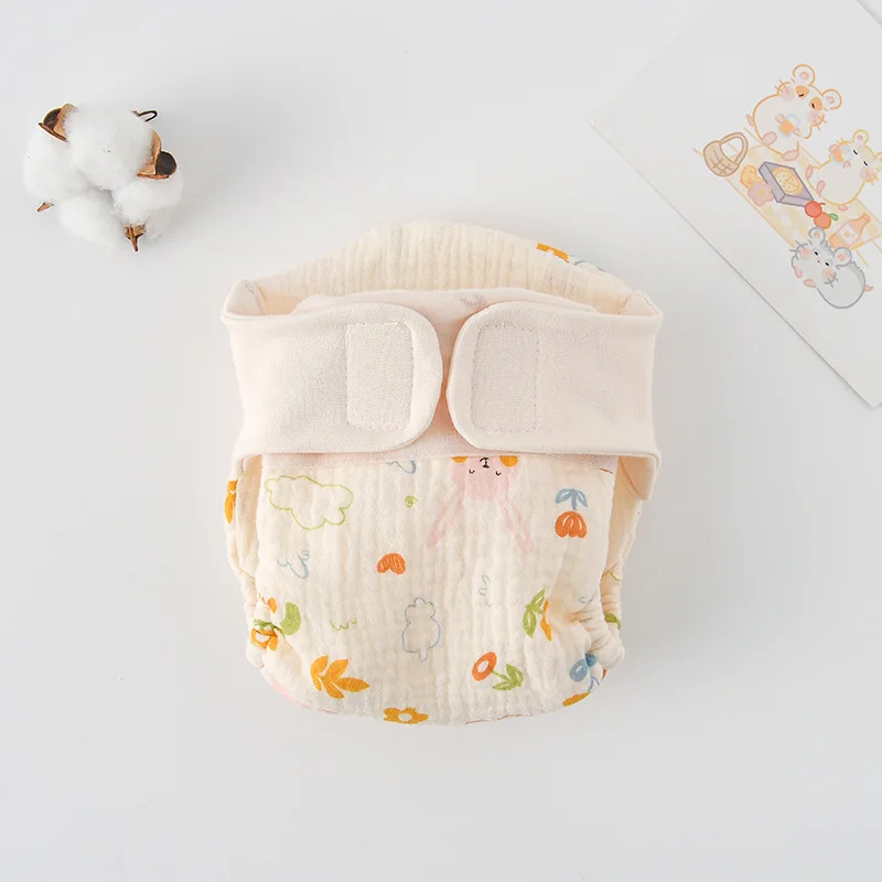 Garden rabbit-print cloth diaper with colorful flowers and a cream waistband