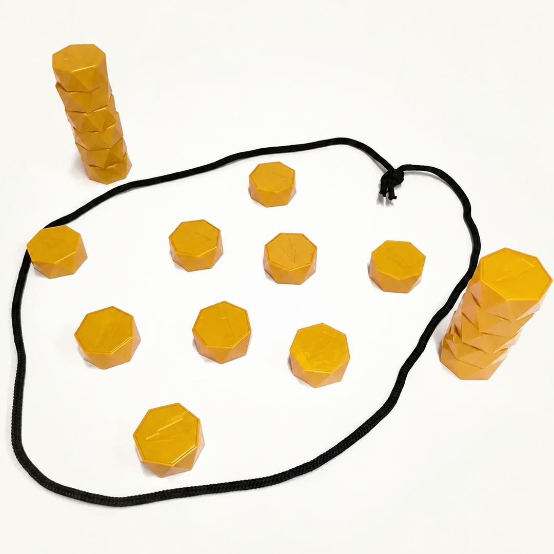Gold magnetic stones inside a black cord loop with stacked stones beside it