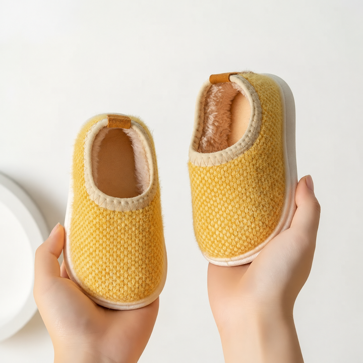 Golden yellow textured slippers with cream-colored trim and white soles