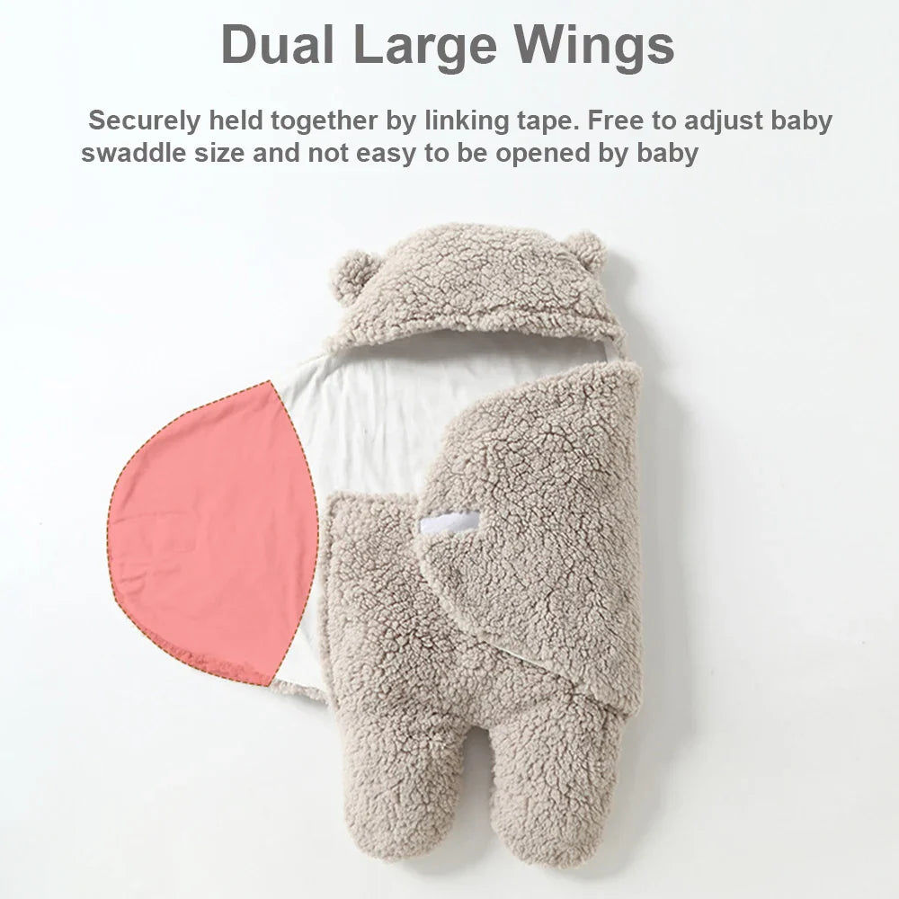 Gray baby wrap with one wing opened to show the lining and overlapping two-wing closure.