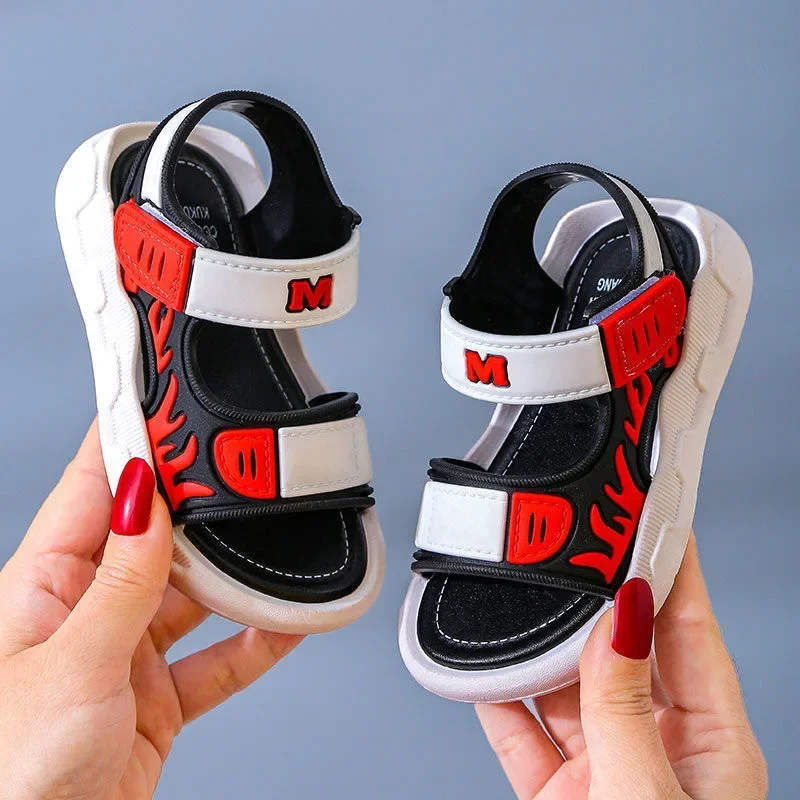 Gray and black sandals with red flame graphics and strap accents