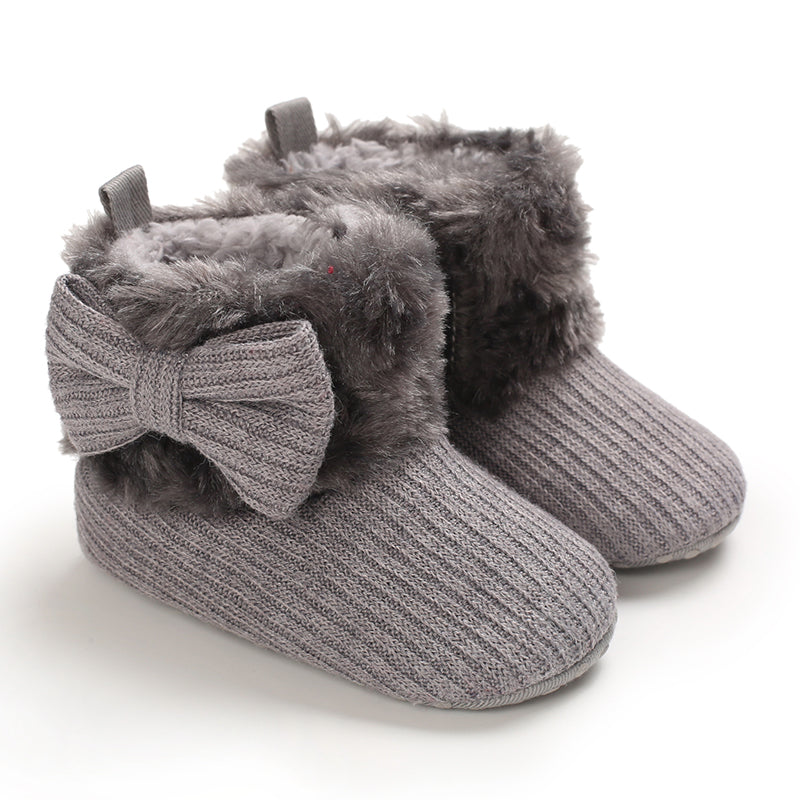 Gray baby winter boots with matching bows and plush ankle cuffs