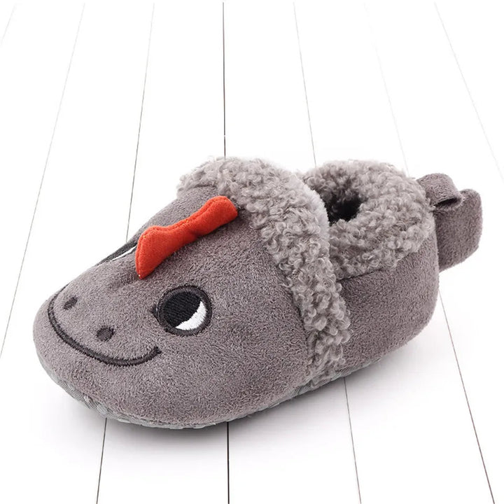 Gray dragon baby slipper with a red crest and fuzzy trim around the opening.