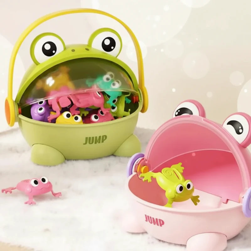 Green handled frog case filled with colorful frogs beside an open pink frog case.
