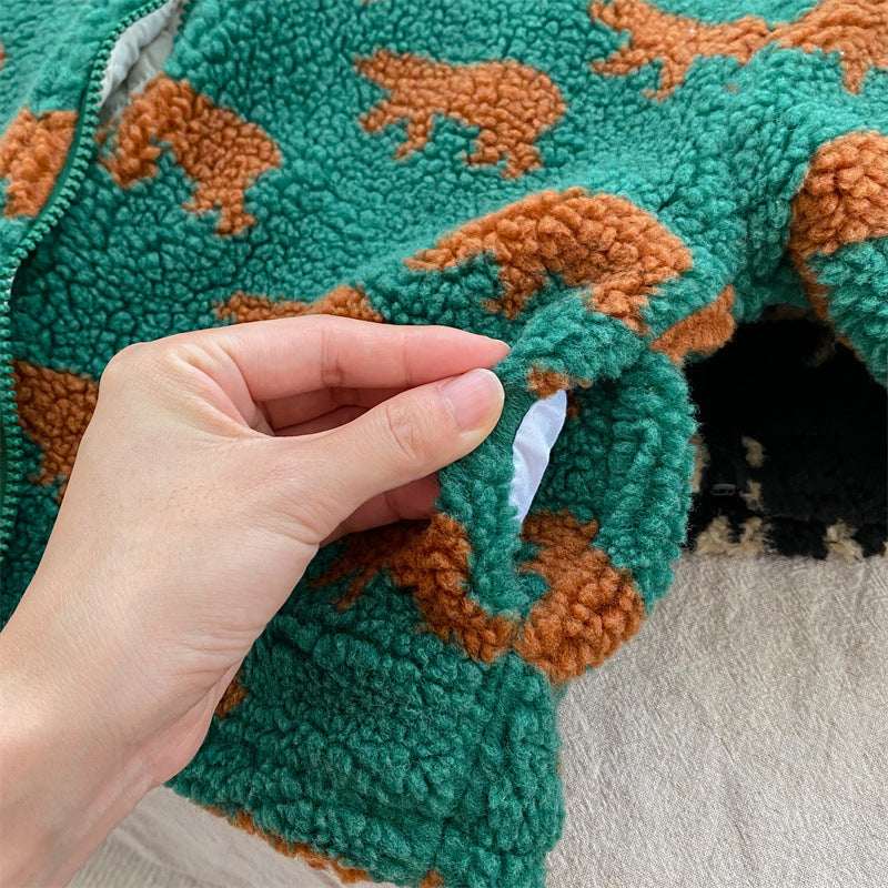 Green bear-print fleece jacket cuff held open to show the inner fabric