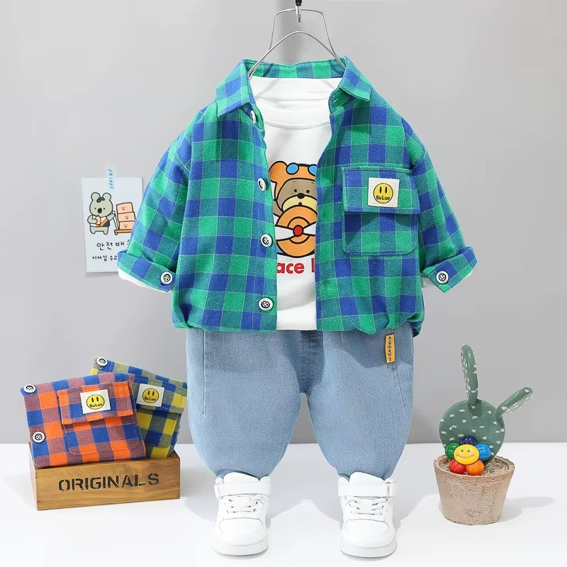 Green-and-blue checkered jacket with a bear-print T-shirt and light blue pants