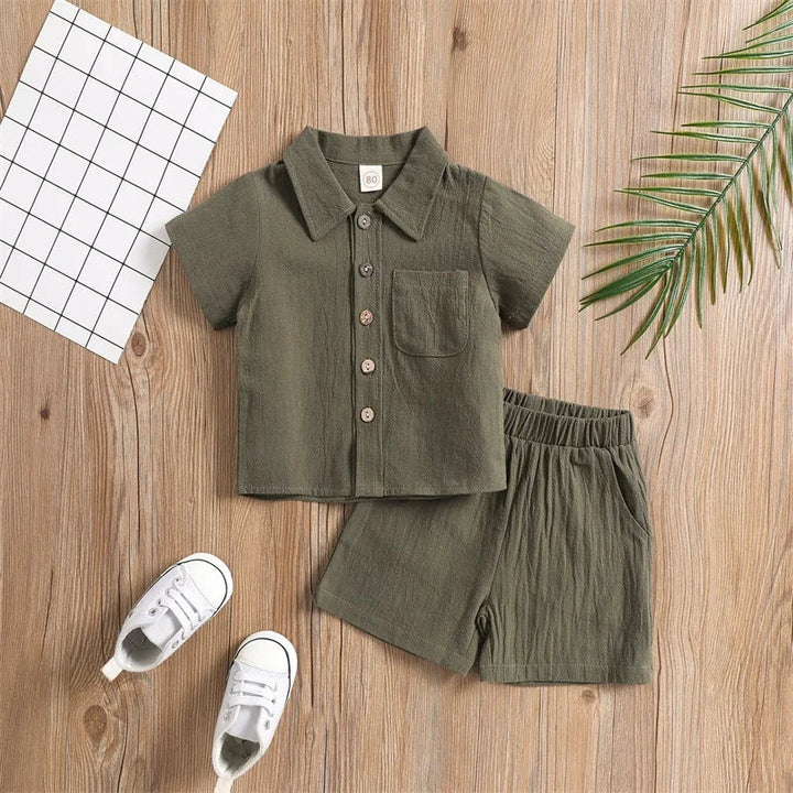 Green short-sleeve collared shirt and matching shorts with an elastic waistband