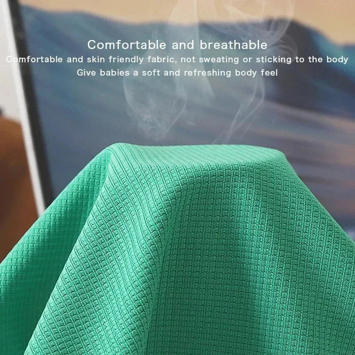 Close-up of green textured fabric with a raised grid pattern