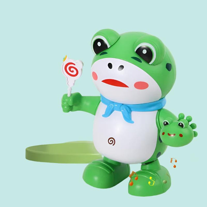 Green frog toy with a blue scarf, spiral lollipop, and small frog detail
