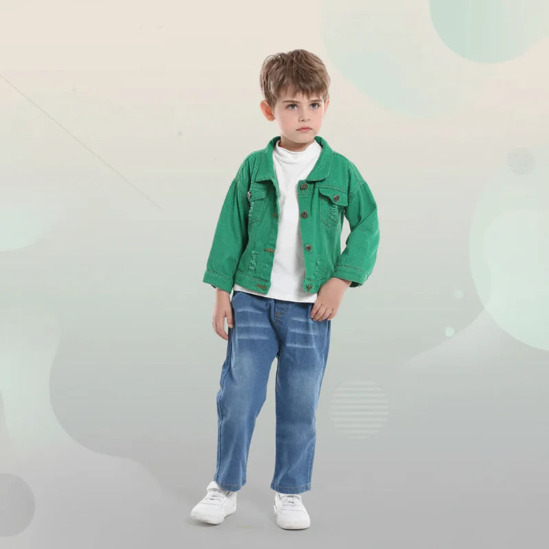 Child wearing a green denim jacket over a white shirt with jeans