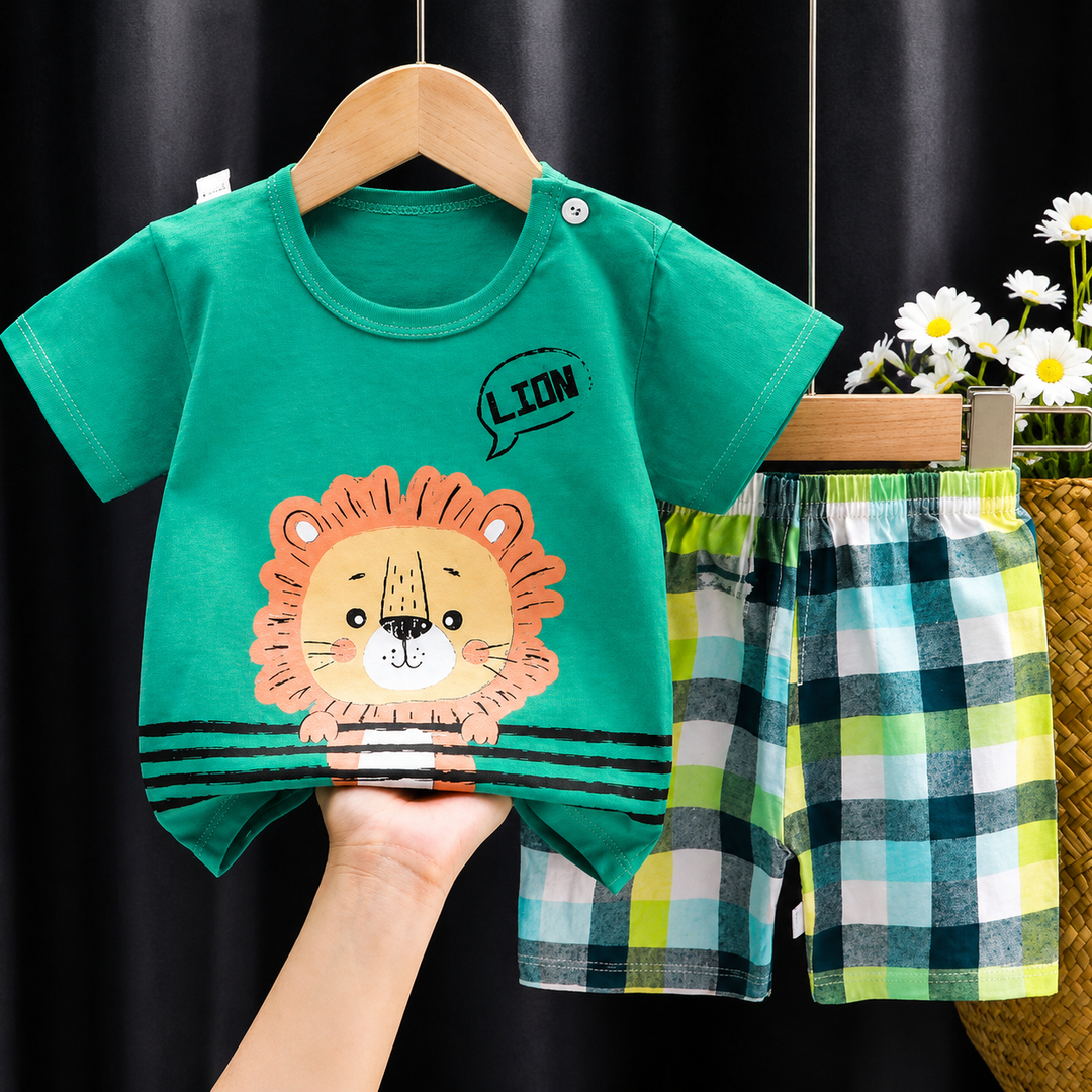 Green lion-print shirt paired with multicolor plaid shorts.