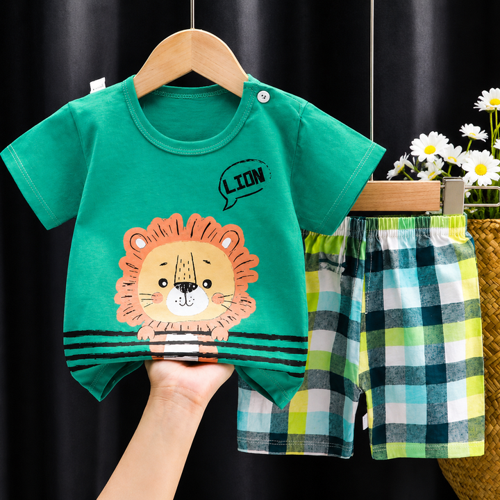 Green lion-print shirt paired with multicolor plaid shorts.