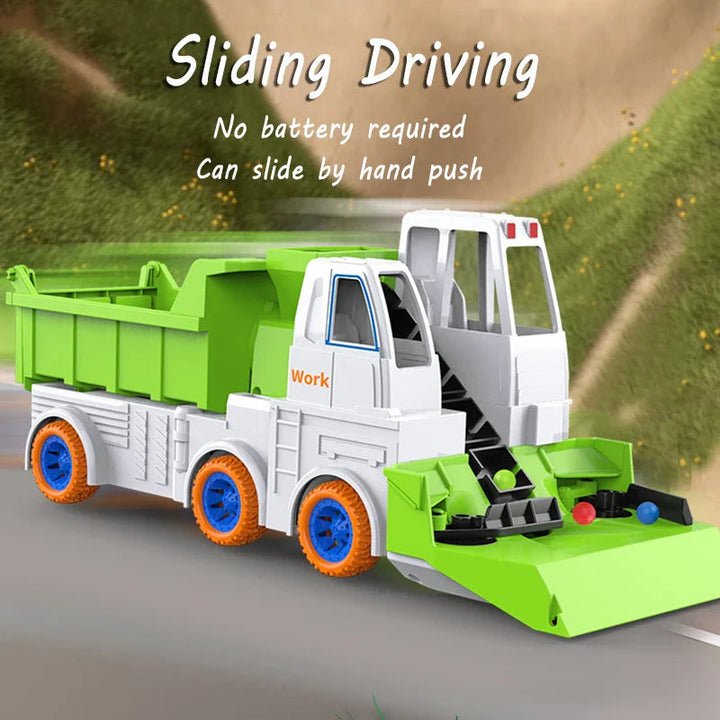 Green push-along dump truck with a front scoop