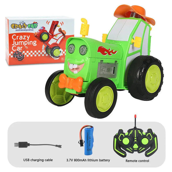 Green RC stunt tractor with orange hat, packaging, USB cable, rechargeable battery, and remote control