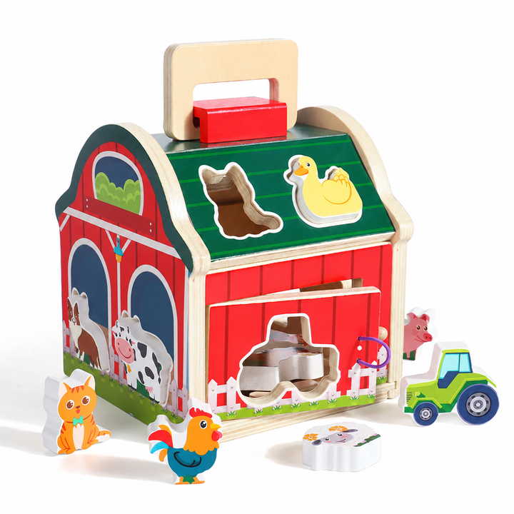 Green-roofed wooden barn with animal-shaped openings and colorful farm play pieces.