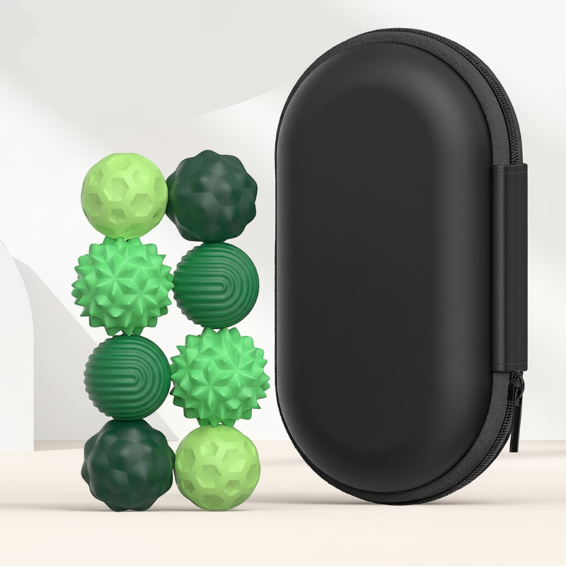 Eight small green textured magnetic beads beside a tall black zippered case