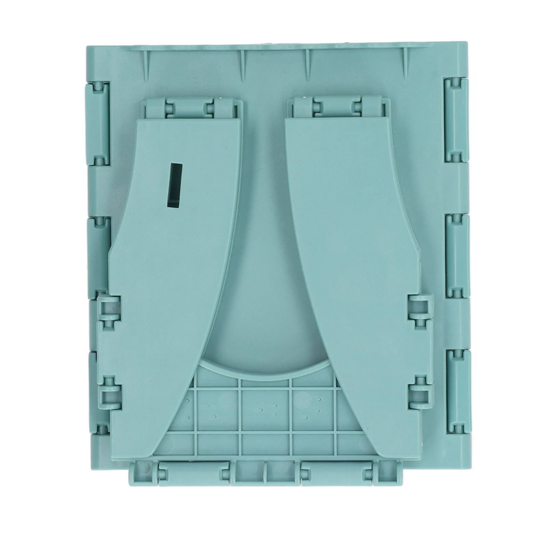 Close-up of the green travel potty folded into a flat rectangle