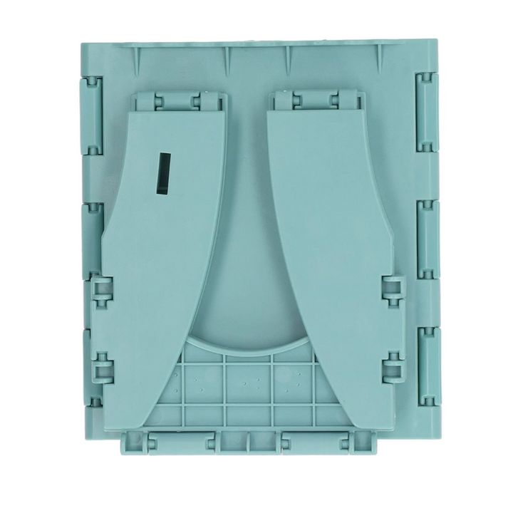 Close-up of the green travel potty folded into a flat rectangle