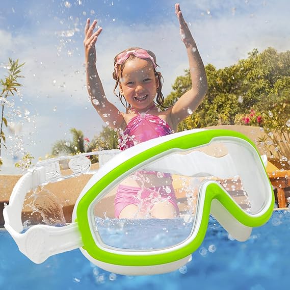 Child splashing in a pool above a close-up of green and white swimming goggles