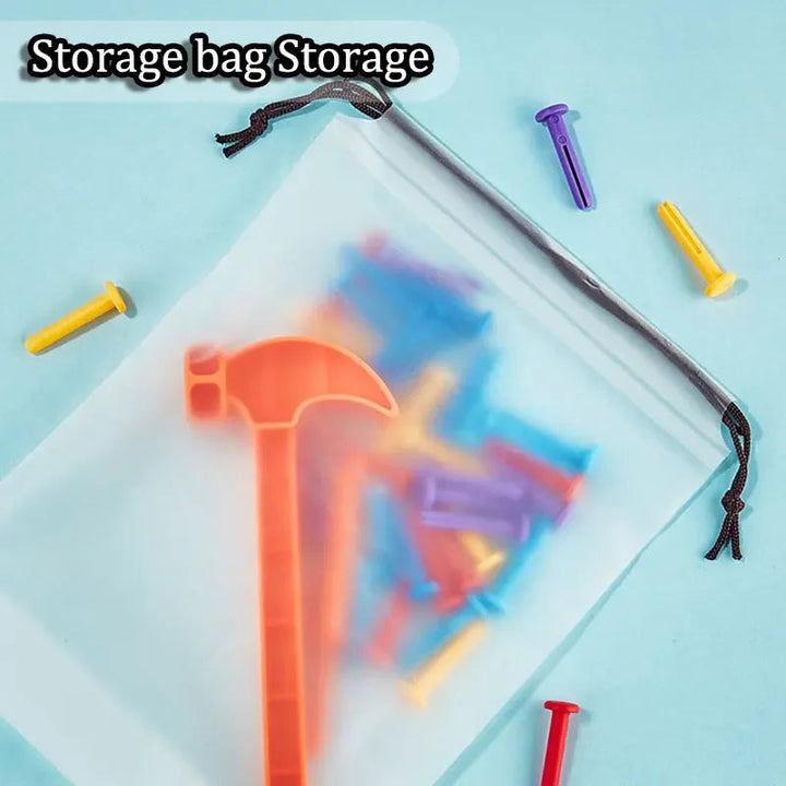 Drawstring storage bag holding an orange toy hammer and colorful pegs