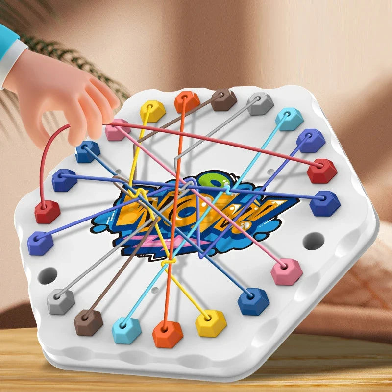 Hand lifting a red elastic rope on a white hexagonal puzzle board.