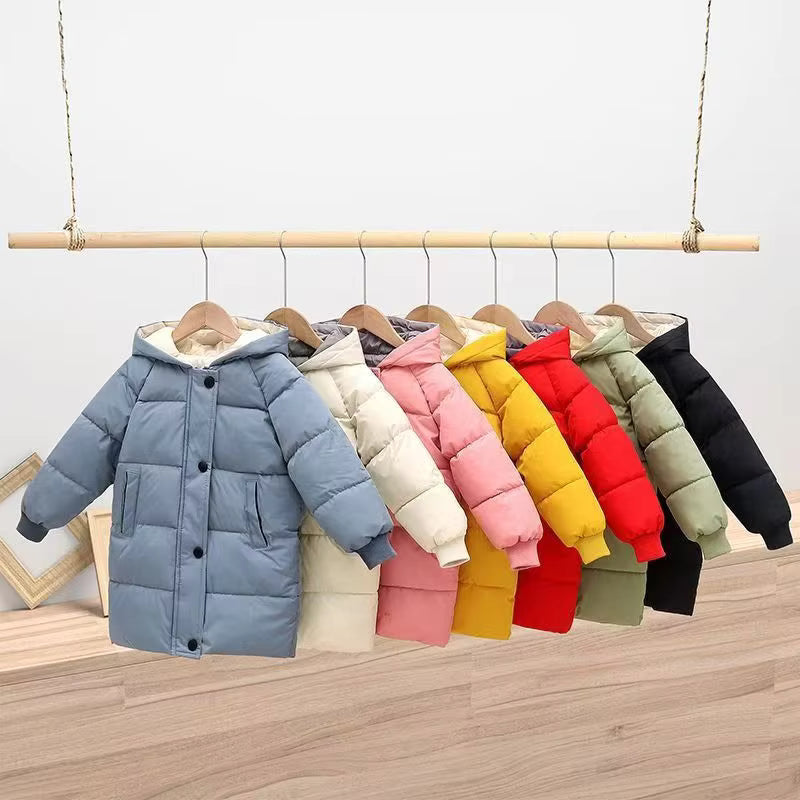 Blue quilted winter coat at the front of a rack of kids' coats in several colors
