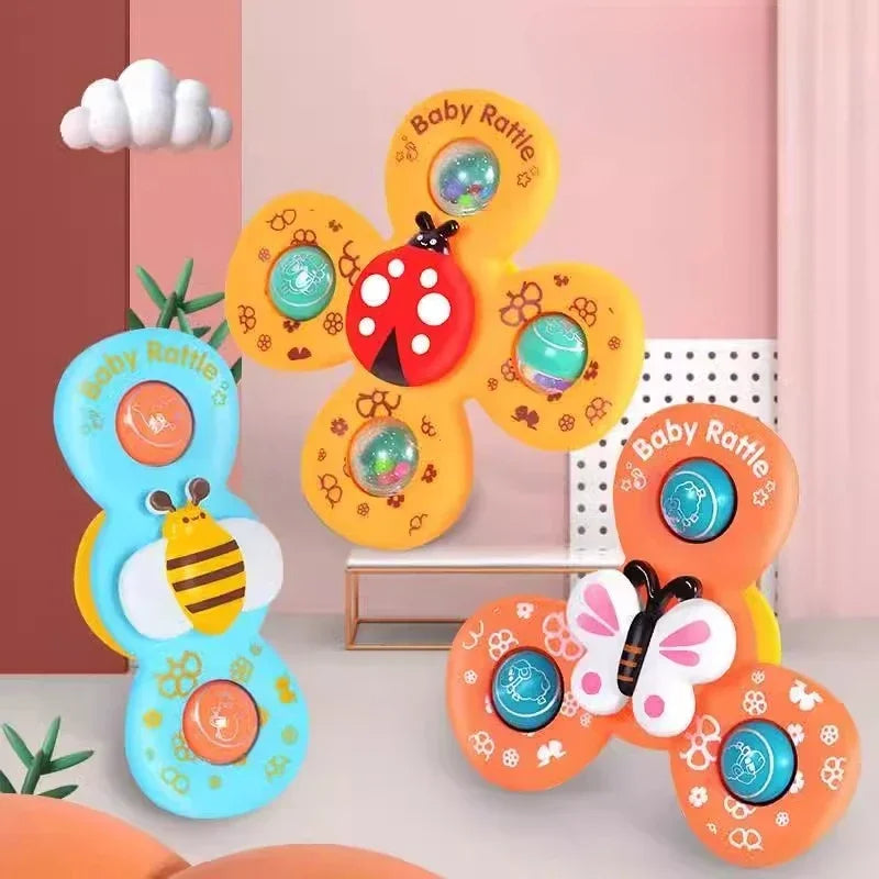 Bee, butterfly, and ladybug suction spinner toys displayed on a pink shelf