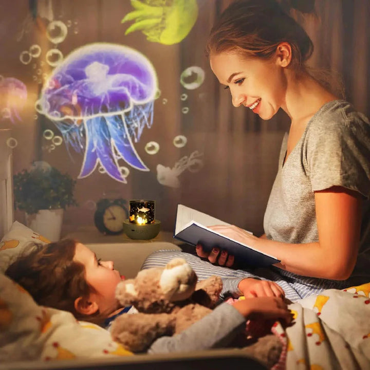 Adult reading to a child beside a night light casting jellyfish patterns on the wall.
