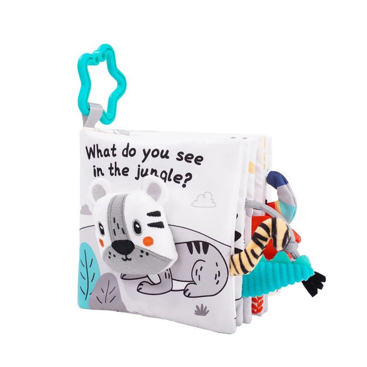 Jungle fabric book with a soft spotted dog, colorful fabric tabs and a turquoise star-shaped clip