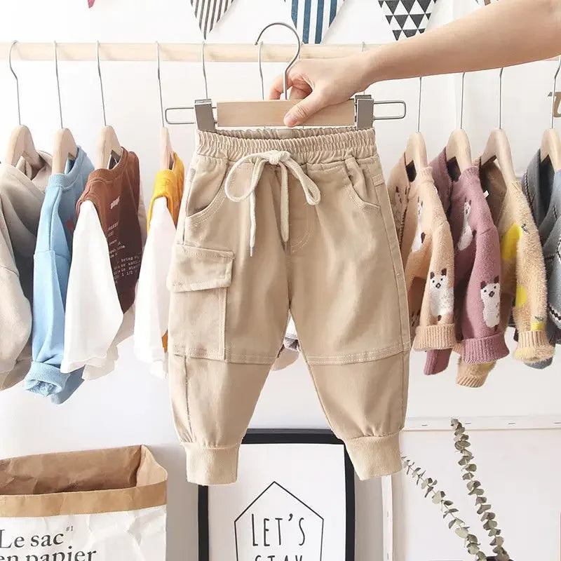 Khaki boys' cargo pants with a drawstring waist, flap pocket, and ribbed ankle cuffs