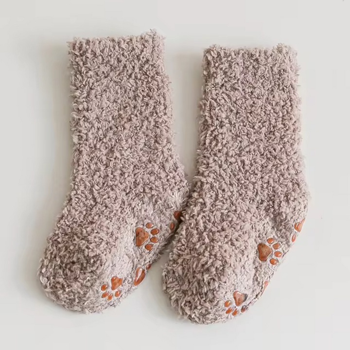 Khaki fleece socks with orange paw-print sole details