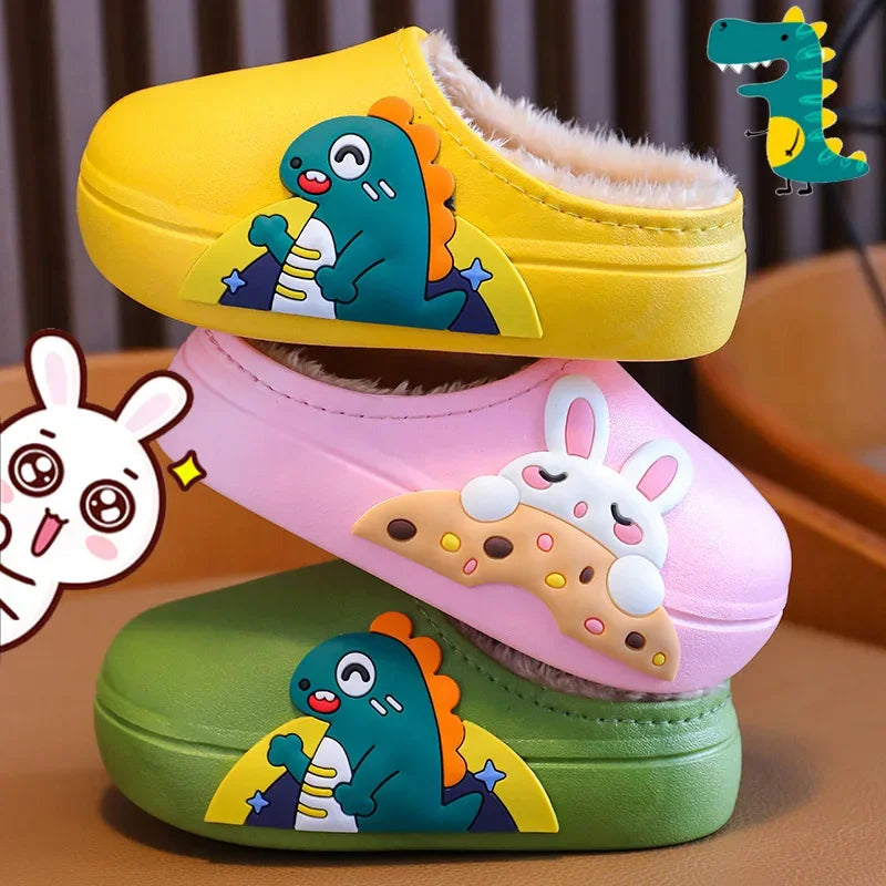 Yellow dinosaur, pink bunny and green dinosaur slippers stacked with their fluffy lining visible