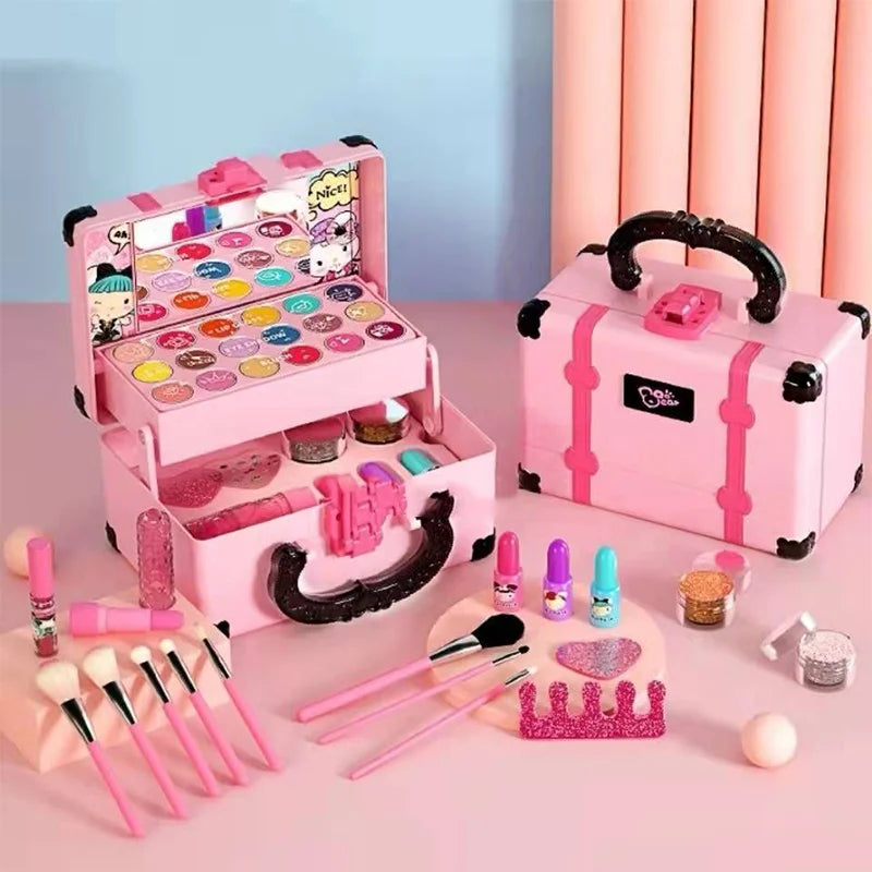Pink kids' makeup set with open and closed cases, brushes, lipstick, nail polish and a tiara