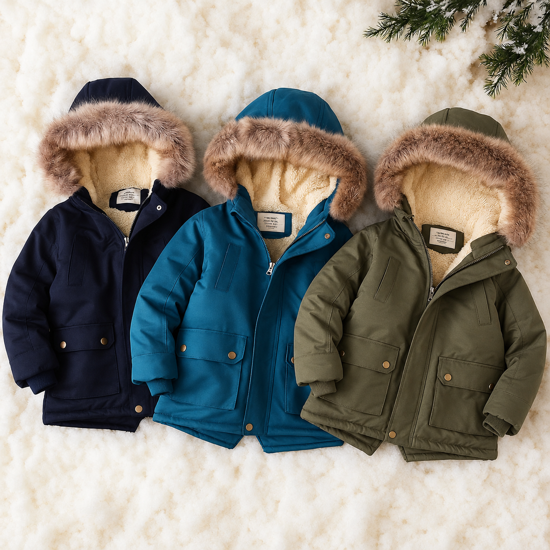 Navy blue, blue and green kids' parkas with lined, faux-fur-trimmed hoods on a cream backdrop