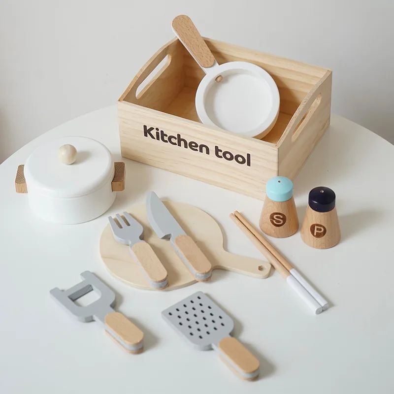 Kitchen play set with a lidded pot, plates, utensils, and salt and pepper shakers