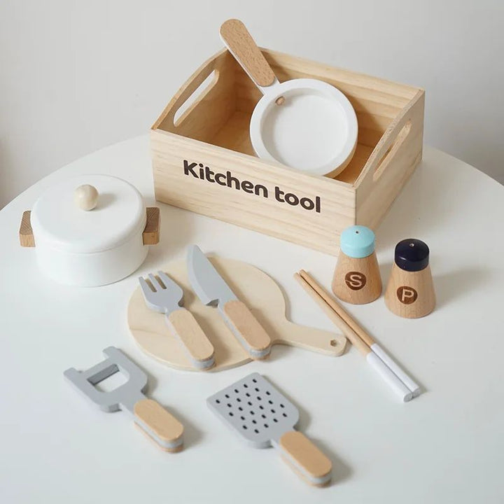 Kitchen play set with a lidded pot, plates, utensils, and salt and pepper shakers