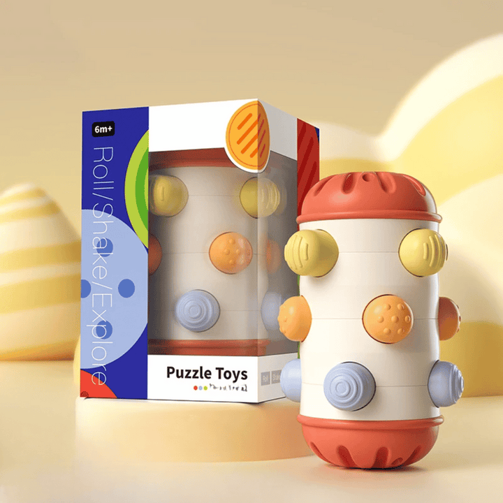 Large red-ended sensory roller with raised multicolored buttons beside its box