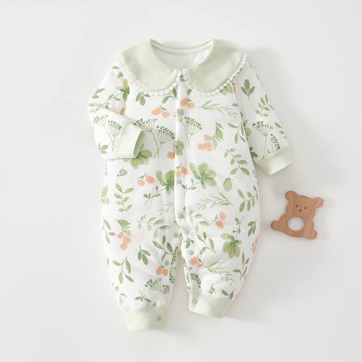 Leafy green-print baby pajamas with a pale green collar and matching cuffs