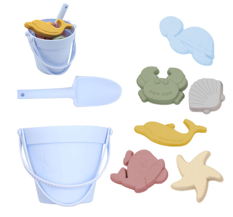 Light blue silicone beach bucket and shovel with six colorful sea-themed sand molds.