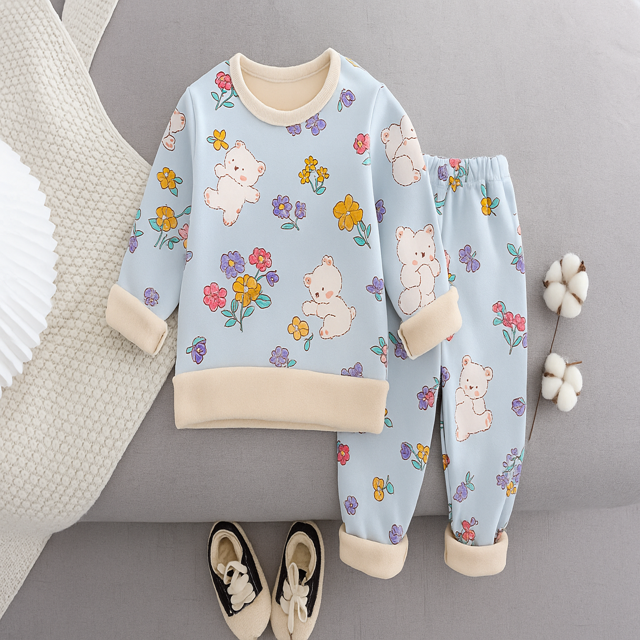 Light blue pajama top and matching pants with bears, flowers, and cream trim