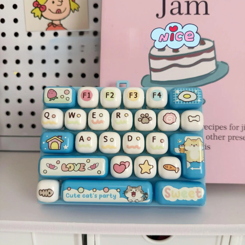 Light blue fidget keyboard with letter keys, cat graphics, hearts, and stars
